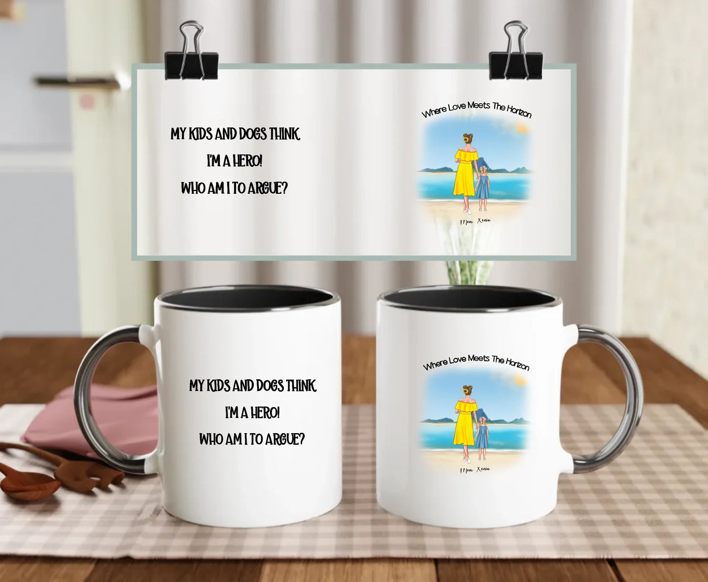 Personalised mug with black handle, showing beach scene of mum and daughter with optional dogs, and “My kids and dogs think I’m a hero” quote – meaningful and funny mum giftk