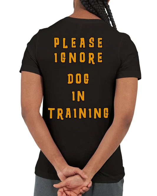 Awareness t-shirt with bold block text reading “PLEASE IGNORE DOG IN TRAINING.” Designed to clearly communicate the need for space and focus, perfect for dog owners, trainers, and handlers of reactive or working dogs.