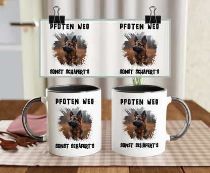 Black-handled dog mug with bold splash effect and photo of a German Shepherd, with the quote “Hands off – or the Shepherd bites!” – perfect gift for protective dog parents