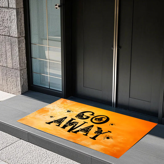A bold, orange Halloween-themed doormat featuring the phrase “GO AWAY” in large black letters, decorated with cartoon witch hats and creepy spiders. A playful and cheeky decorative piece perfect for Halloween-loving households who enjoy a bit of spooky humour at the doorstep. Great for trick-or-treaters or Halloween parties.