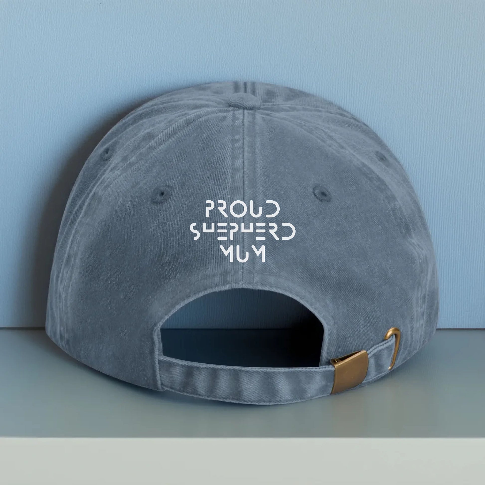 Personalised blue cap with adjustable fit and white embroidered text on the back. Ideal for showcasing a dog’s name, special message, or personal phrase — great for proud pet owners.