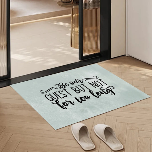 A witty and minimalist doormat featuring the cheeky quote “Be our guest but not for too long” in black handwritten script on a light neutral background. Ideal for those who love subtle humour in home décor — perfect for entryways, porches, or as a gift for housewarming hosts with personality.