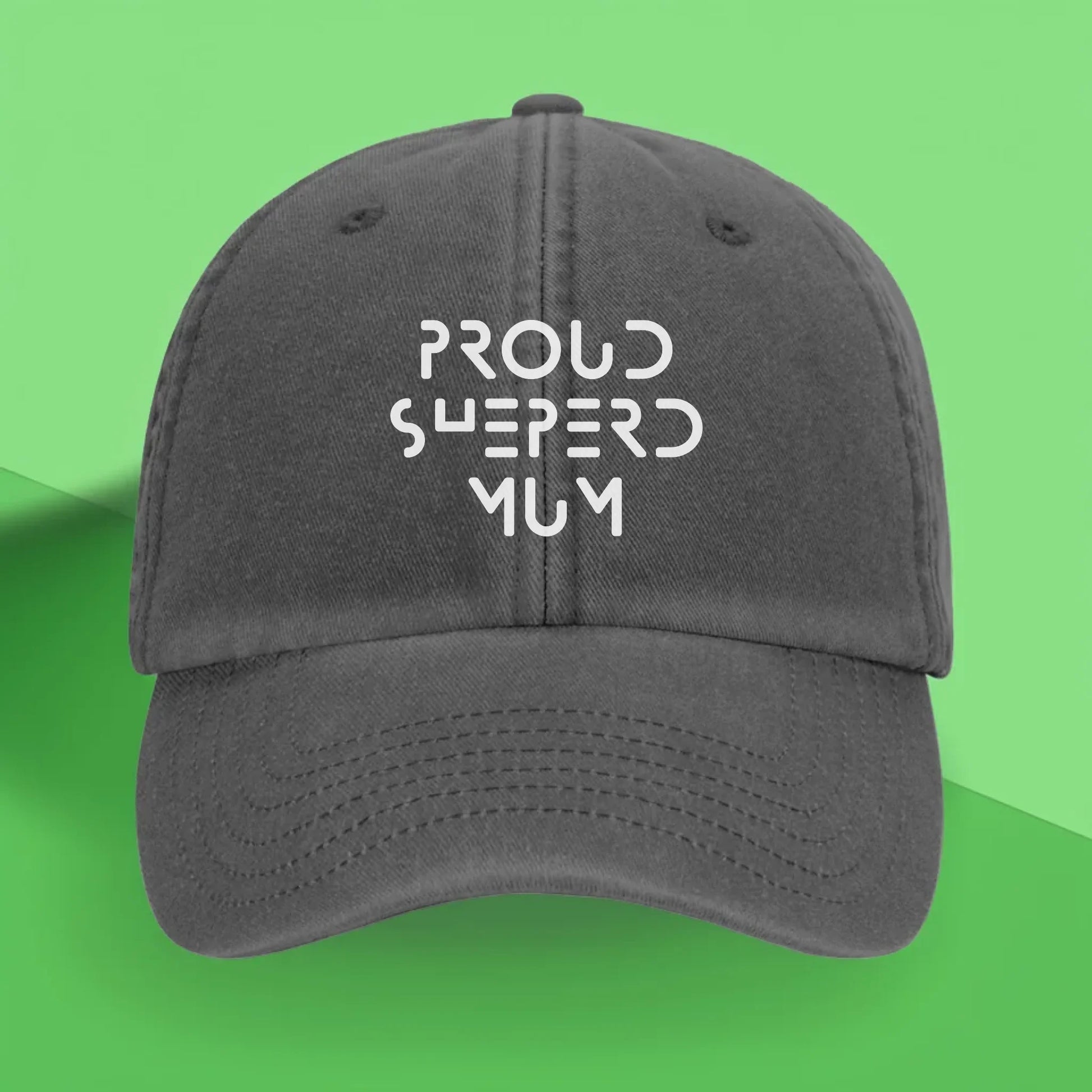 Grey vintage-style personalised baseball cap with white embroidery. Custom text can be added – perfect for proud dog mums or dads, and a thoughtful gift for pet lovers.