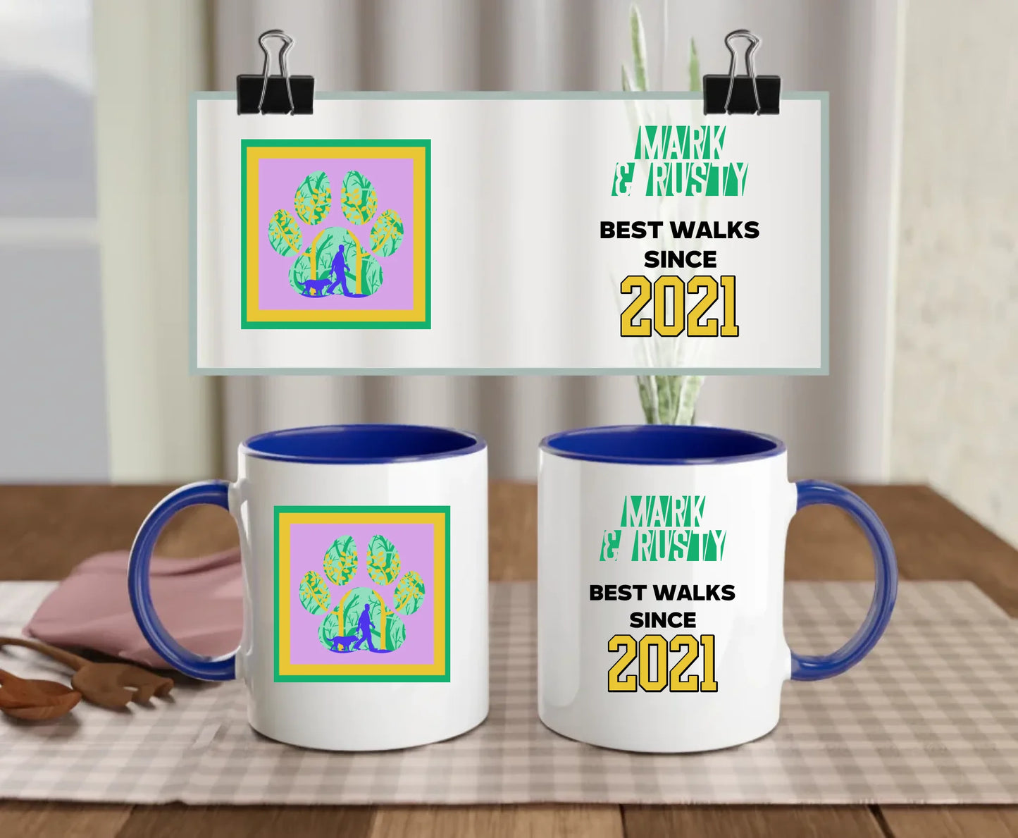 Personalised ceramic dog walking mug with navy handle and interior, featuring names "Mark & Rusty", colourful paw print with walking scene, and "Best walks since 2021" text – custom gift for dog dads or best friends