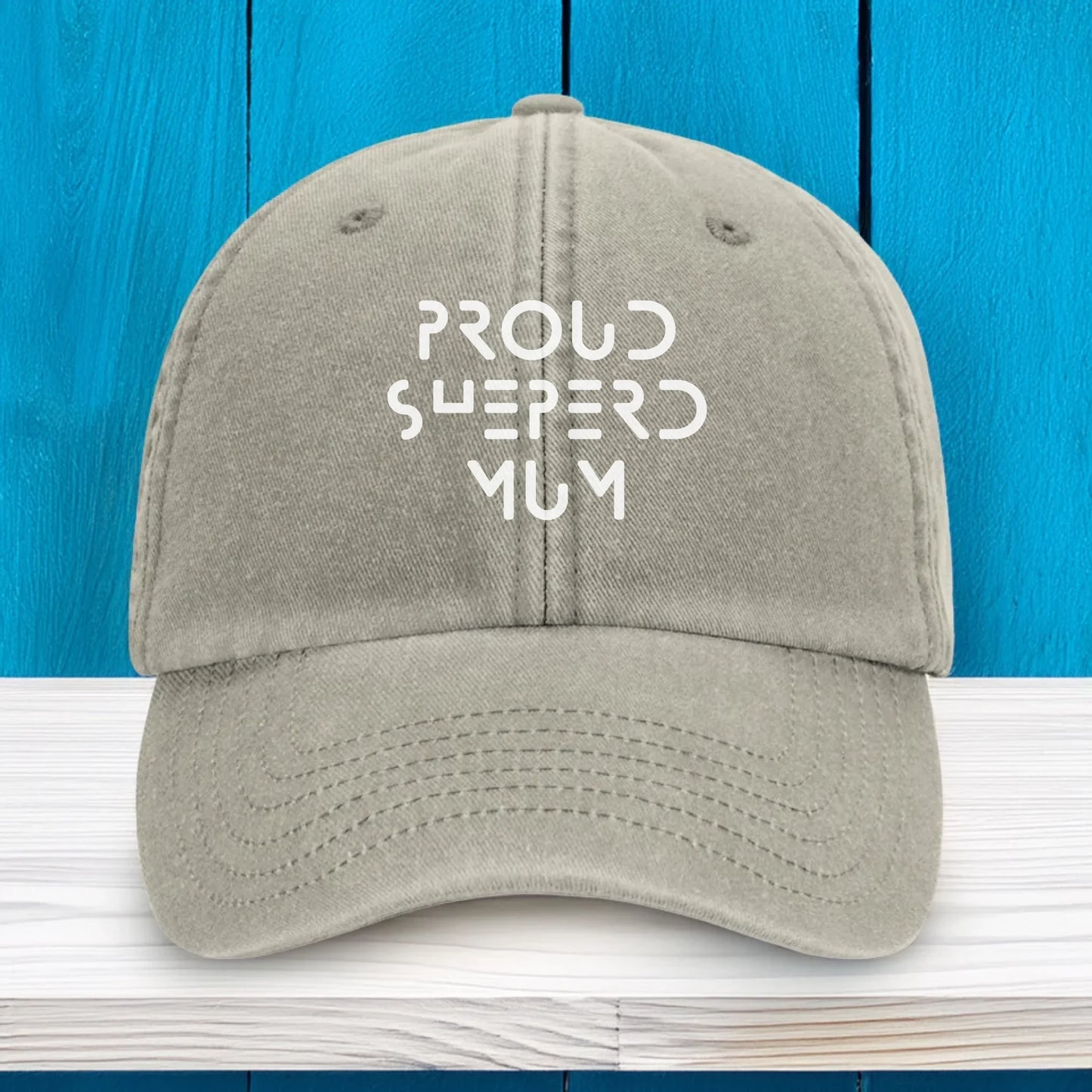 Sand-coloured vintage-style personalised cap with white embroidery on the front. Customisable with any text, making it a perfect everyday accessory or heartfelt gift for dog mums, dads, or pet lovers.